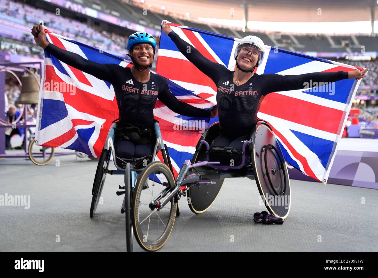 Great Britain's Hannah Cockroft (right) celebrates winning gold and Kare Adenegan celebrates winning silver in the Women's 100m T34 Final at the Stade de France on day four of the Paris 2024 Summer Paralympic Games. Picture date: Sunday September 1, 2024. Stock Photo