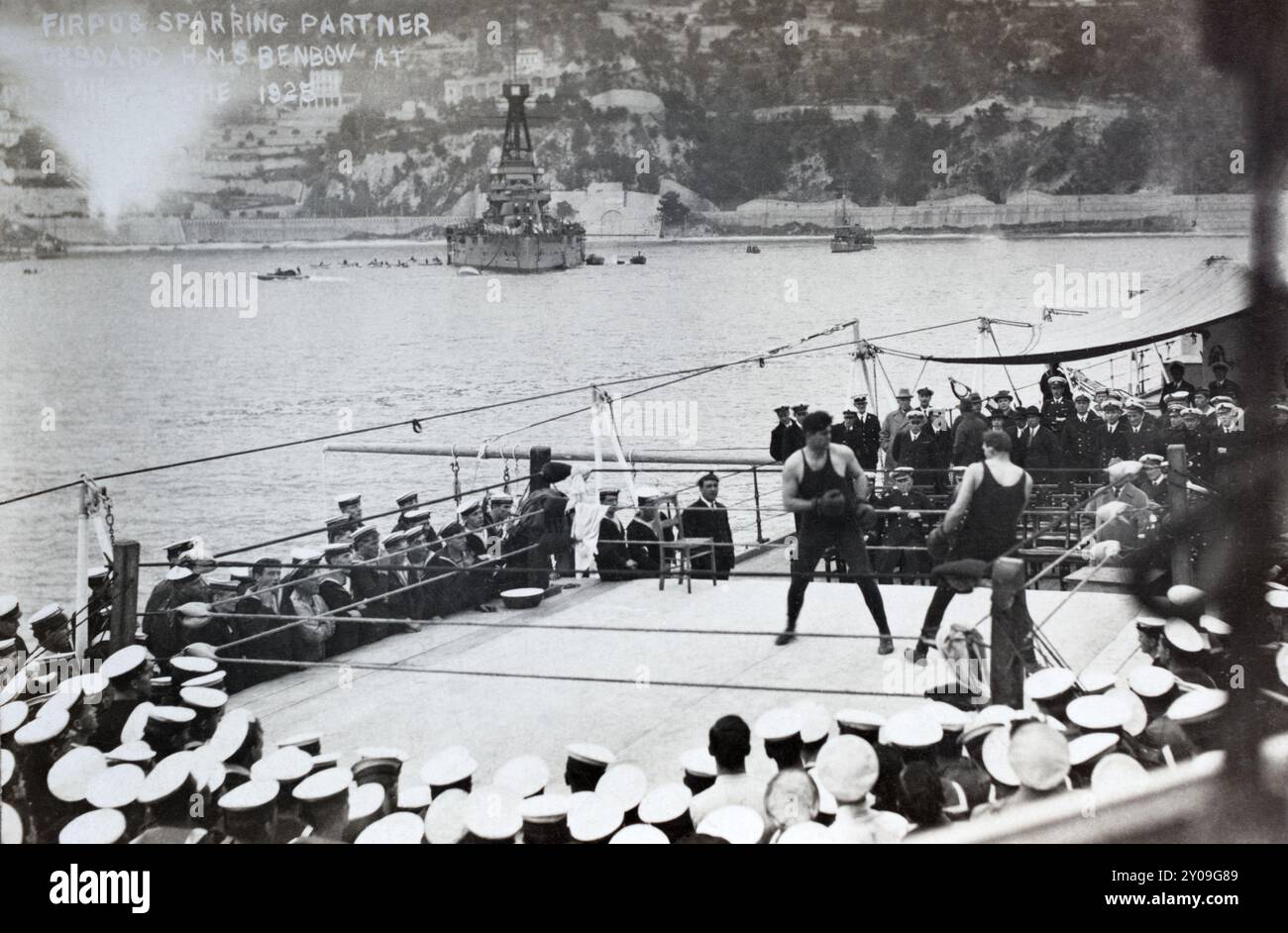 'The Wild Bull of the Pampas', the Argentinian heavyweight boxer Luis Ángel Firpo sparring on HMS Benbow in the harbour of Villefranche, France, February 1925. Stock Photo