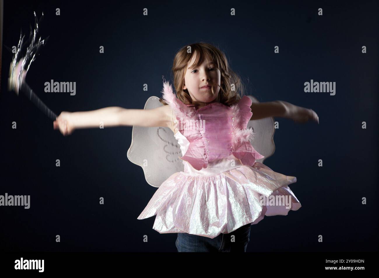 Little girl dressed up as a fairy with a magic wand Stock Photo - Alamy