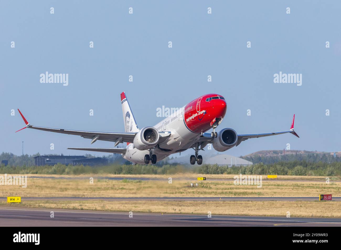 Norwegian's Boeing 737 MAX taking off from Helsinki airport Stock Photo