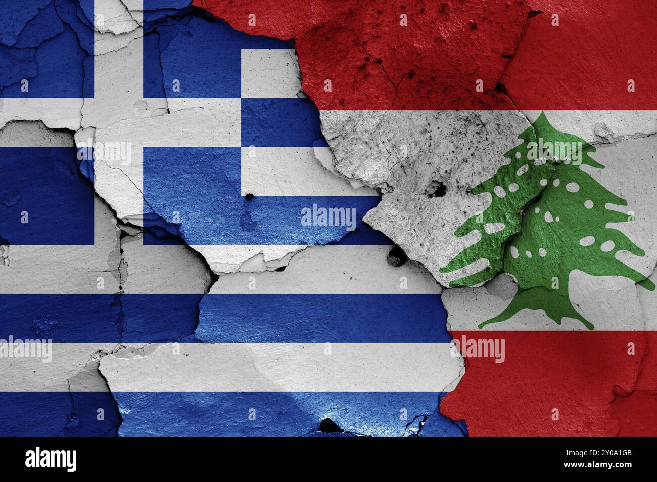 Flags of Greece and Lebanon painted on cracked wall Stock Photo