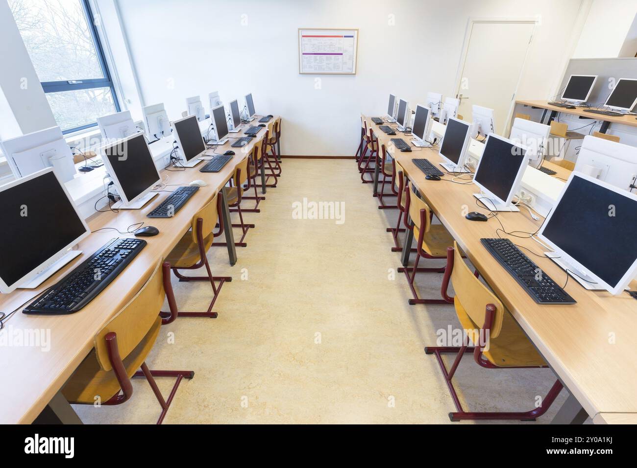 Desktop computers in computer lab on high school Stock Photo - Alamy