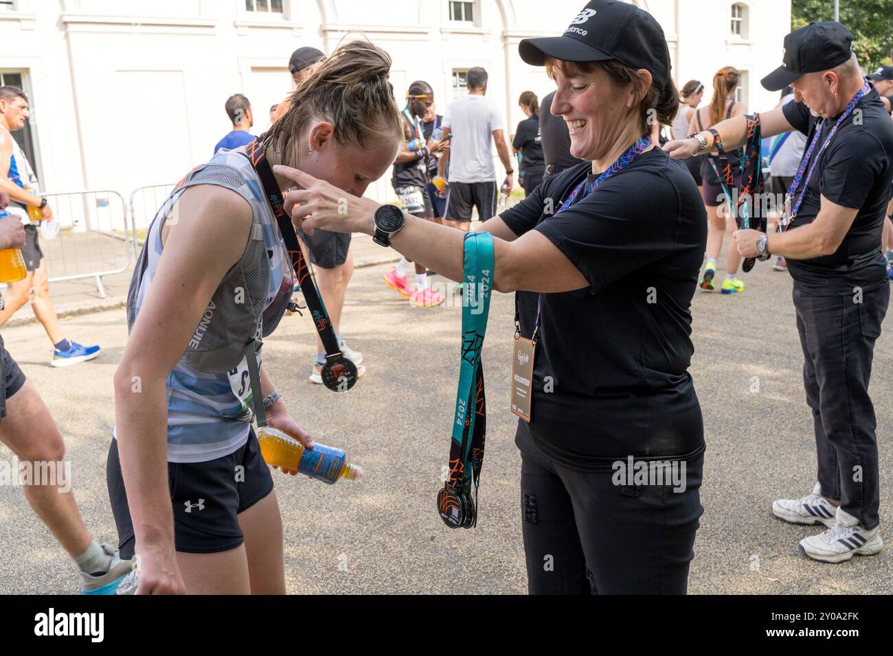 London, UK, 1st September 2024 Runners enjoy the sunshine after the