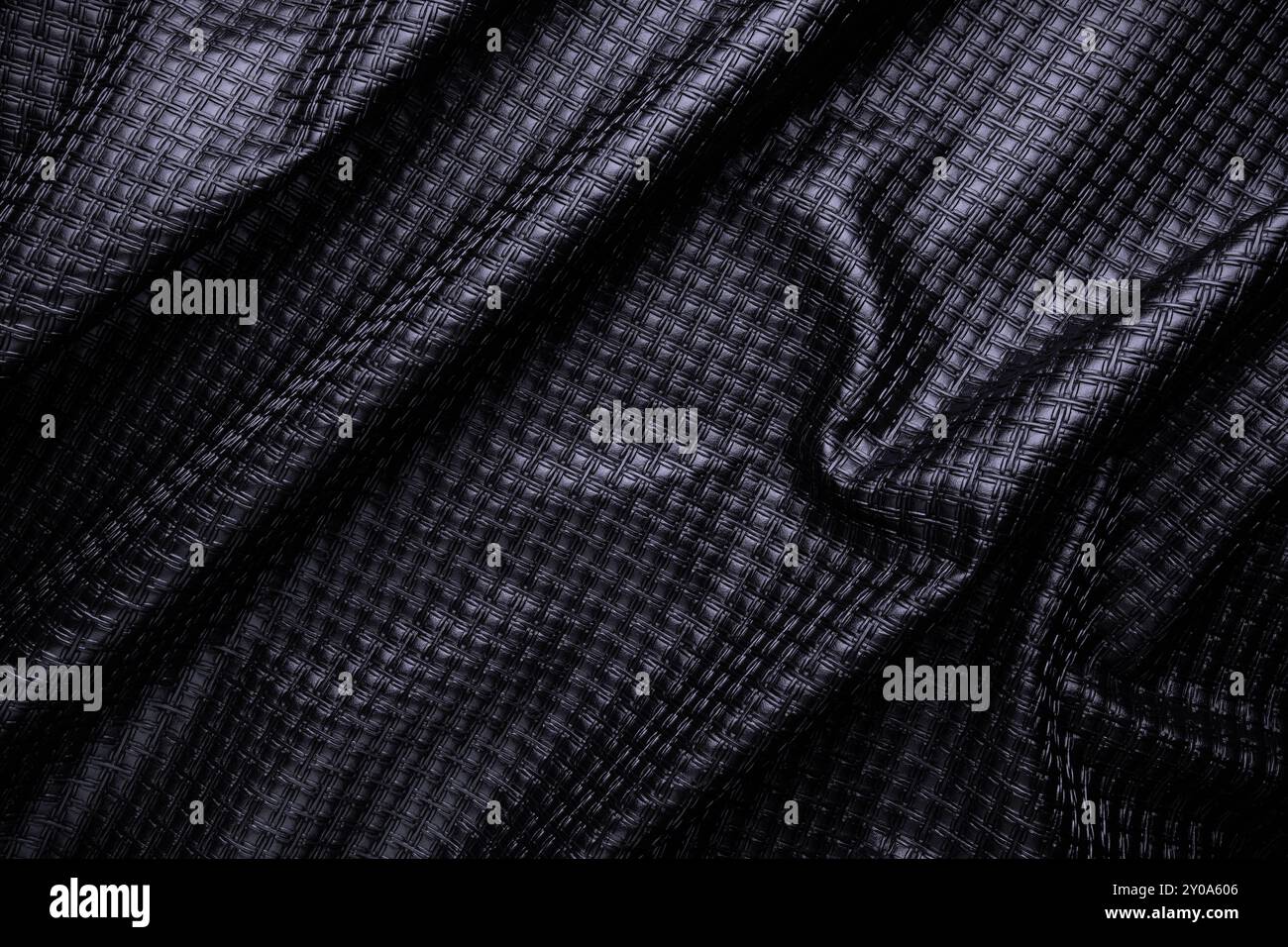 black vegan leather with pattern, fake crumpled textile texture Stock Photo