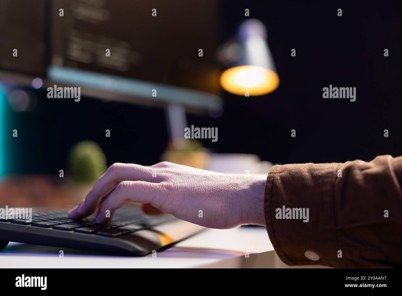 Programmer implementing and maintaining security measures to protect company systems and data. Admin writing, testing and debugging Java code for web and mobile applications, close up Stock Photo