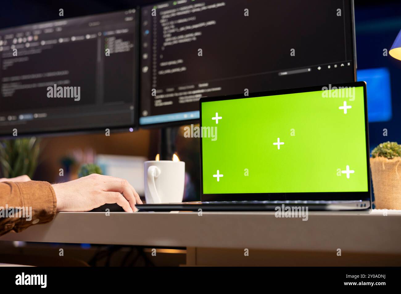 Developer working on isolated screen laptop, futureproofing company network from downtimes and unexpected system failures. Admin using chroma key notebook, increasing data security, close up Stock Photo