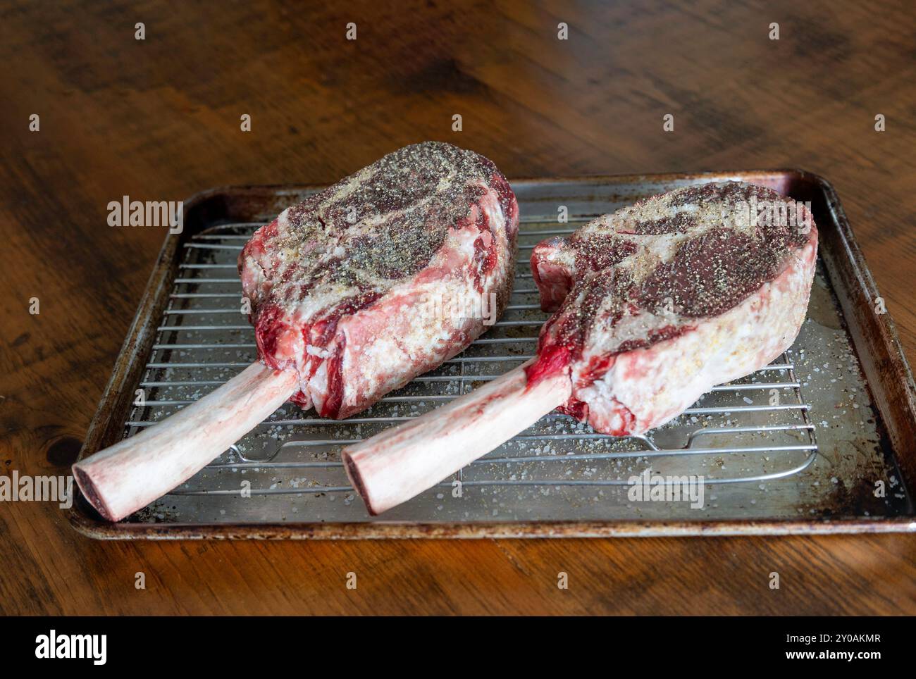 Raw Tomahawk Steaks ready for the bbq Stock Photo
