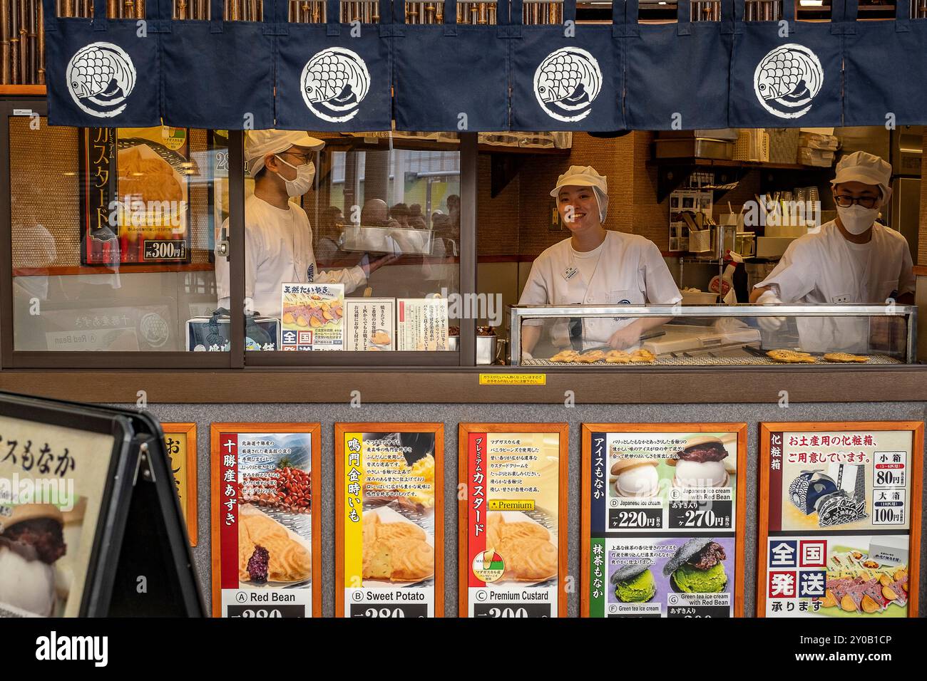 Taiyaki and ice cream shop in Hon dori street, shopping covered arcade, Hiroshima, Japan Stock Photo