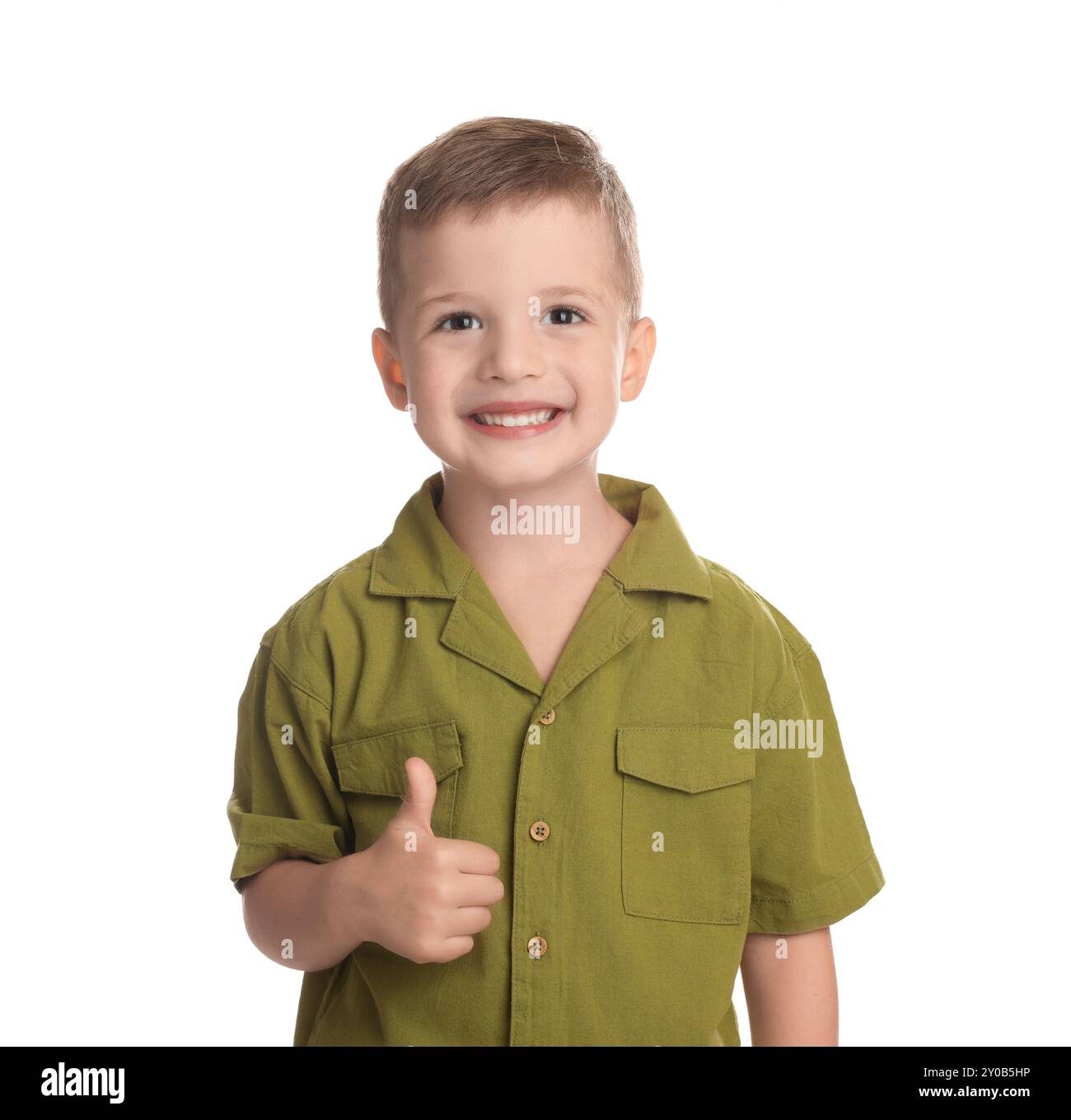 Cute little boy showing thumbs up on white background Stock Photo - Alamy