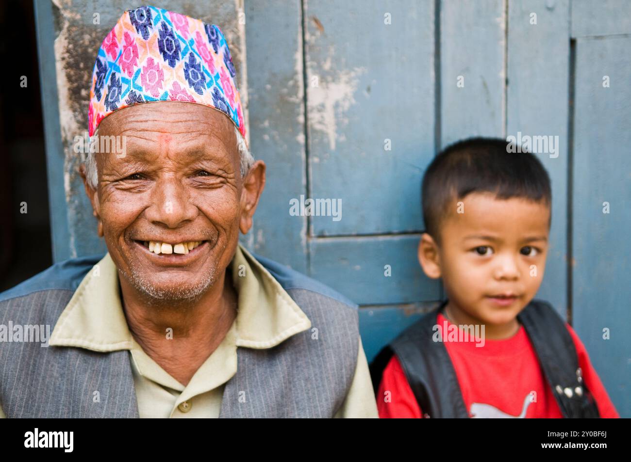 Portrait of a Nepali man wearing a traditional Dhaka Topi hat ...