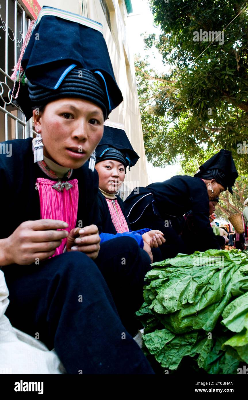 Black Yao woman at a colorful weekly market in southern Yunnan province ,by the border of Vietnam, China. Stock Photo