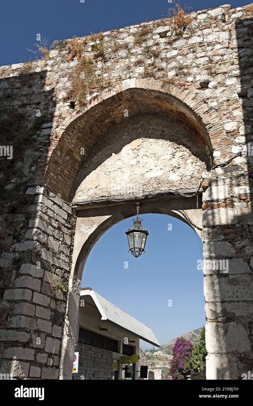 The medieval arch of Porta Catania in Taormina, Sicily, Italy, Europe Stock Photo