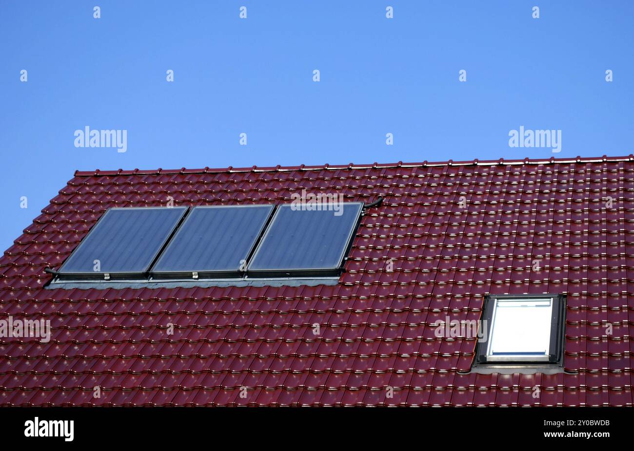 Solar collectors on the house roof for warm water supply Stock Photo ...