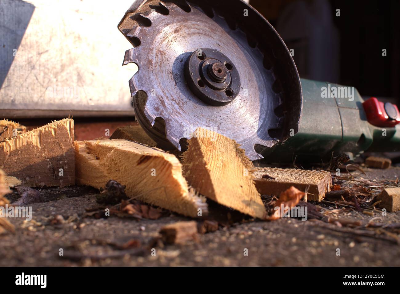Cutter Blade Rusted Close-up of a rusted circular saw blade slicing through wooden logs ...