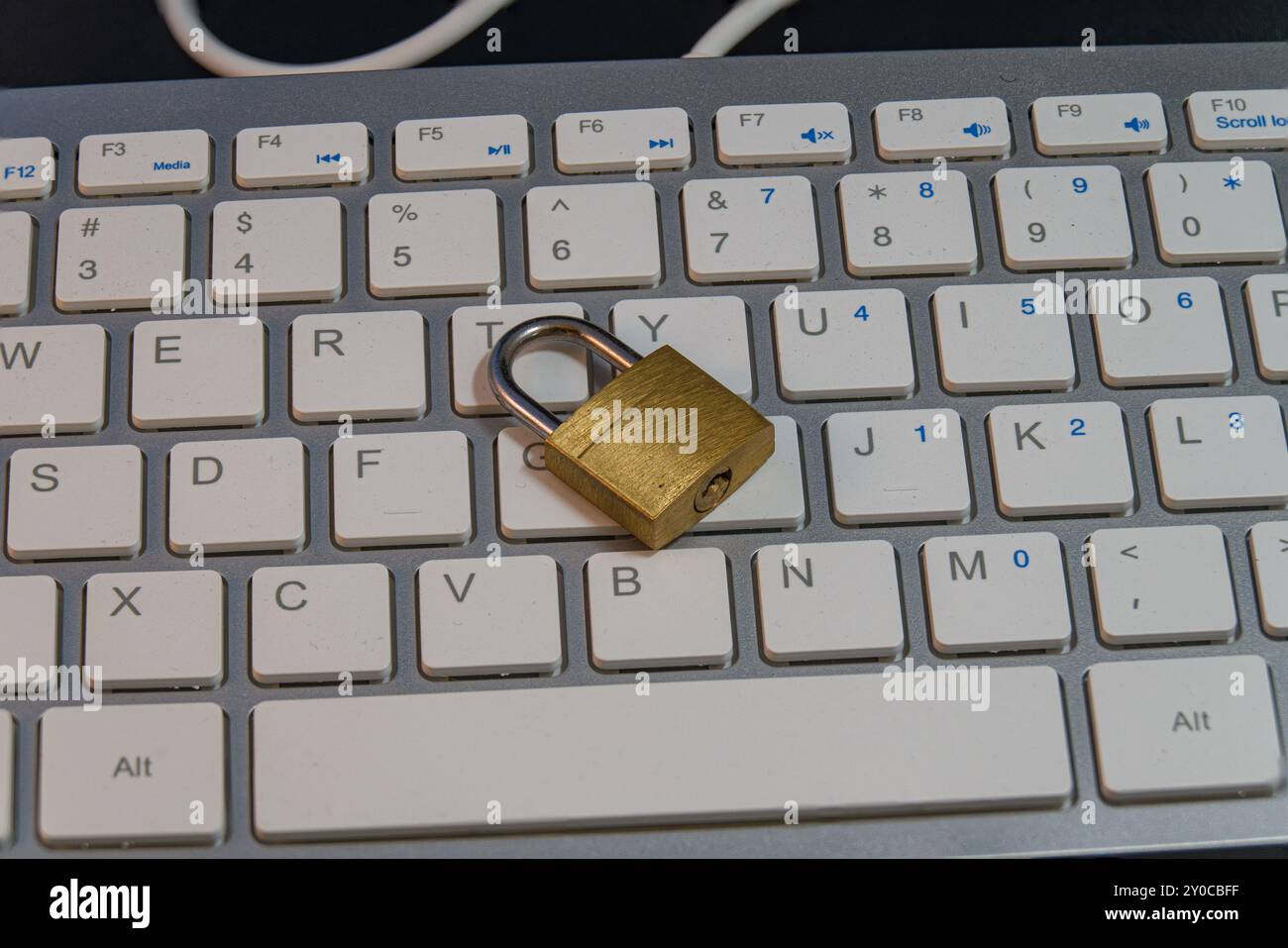 Padlock on a computer keyboard, cybersecurity Stock Photo