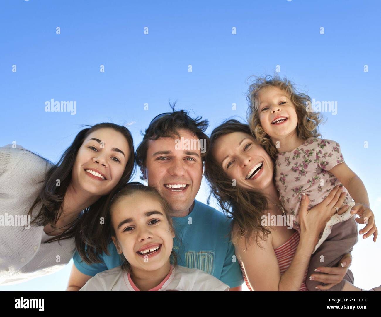 Group of happy smiling friends: man, women and kids having fun outdoors ...