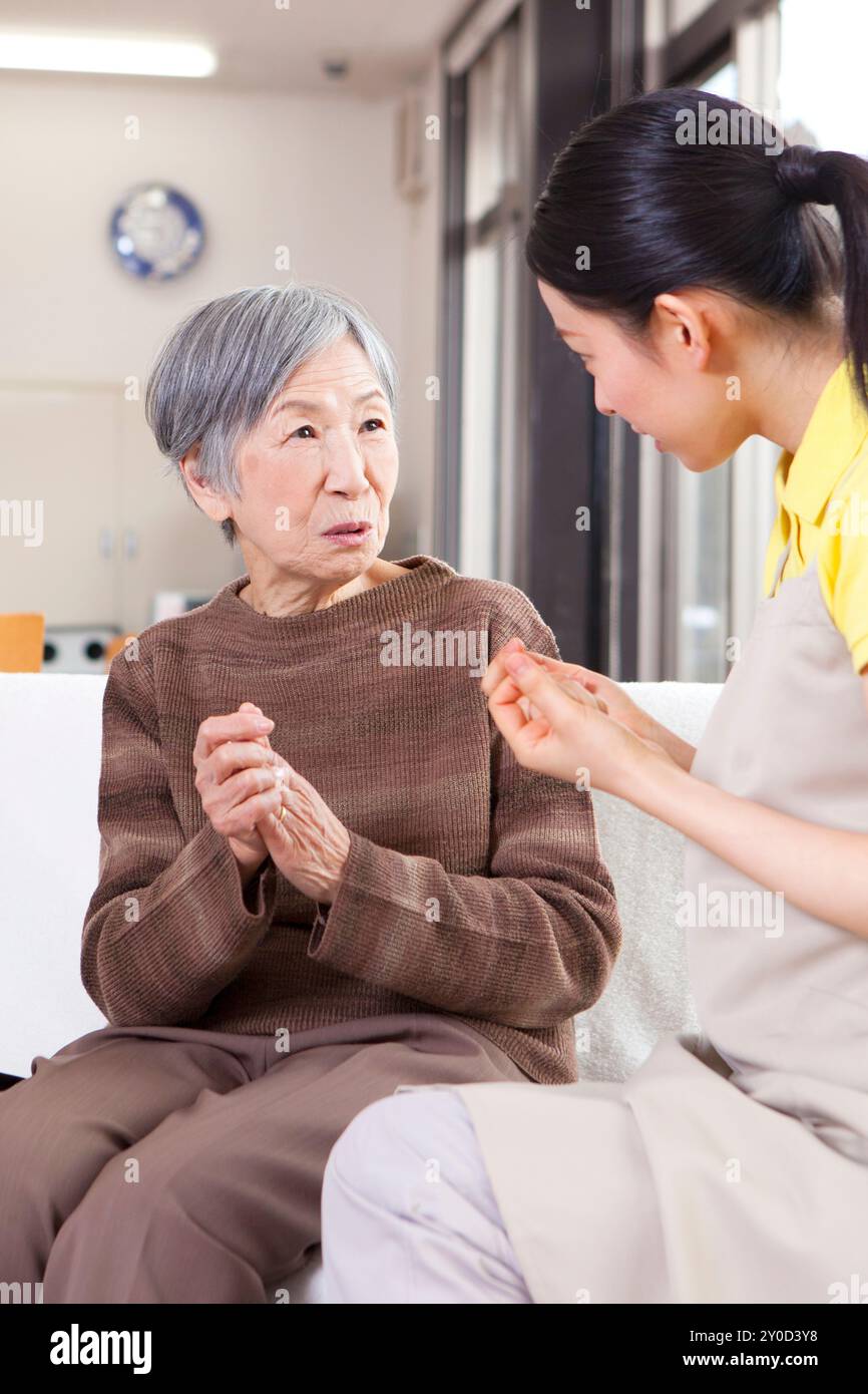 An Elderly Woman Having A Conversation With A Caregiver Stock Photo Alamy