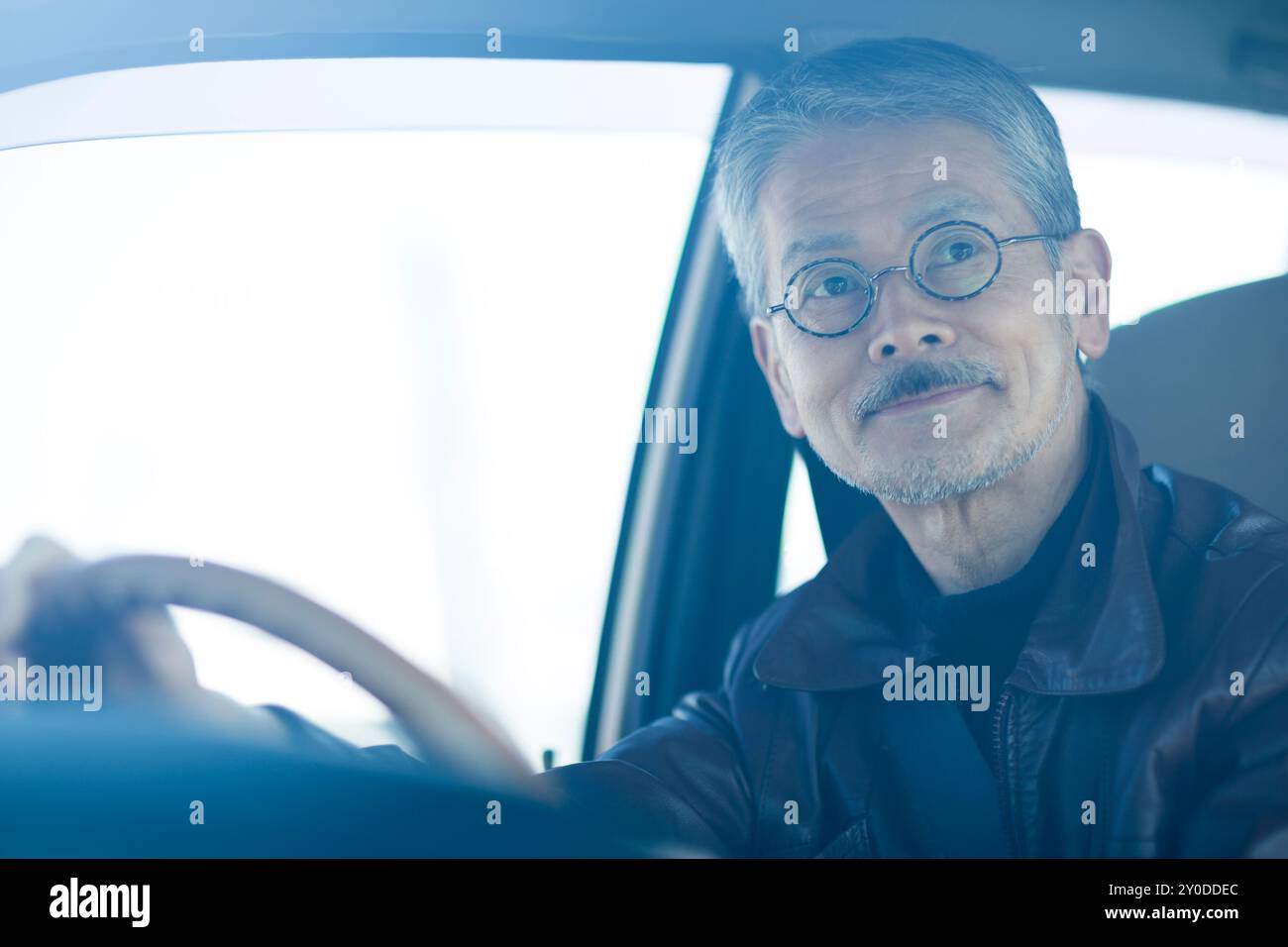 Man driving holding car wheel hi-res stock photography and images - Alamy