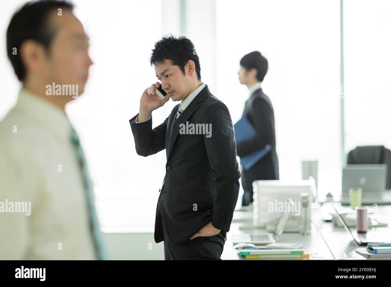 Businessman making a phone call at the office Stock Photo - Alamy