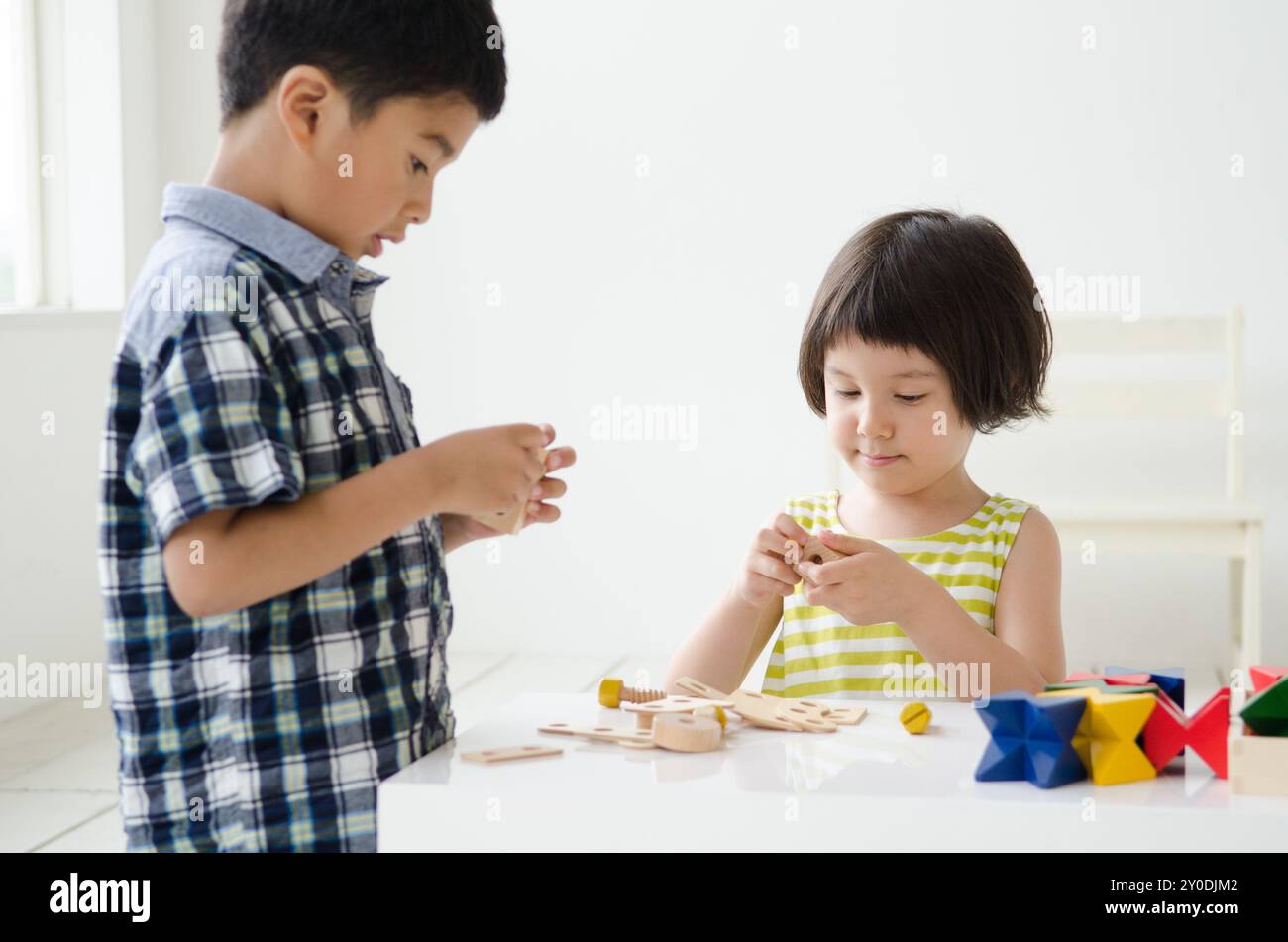 Children playing with educational toys Stock Photo - Alamy