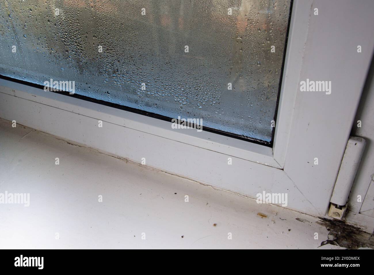 due to the high humidity, water flows through the window glass Stock ...