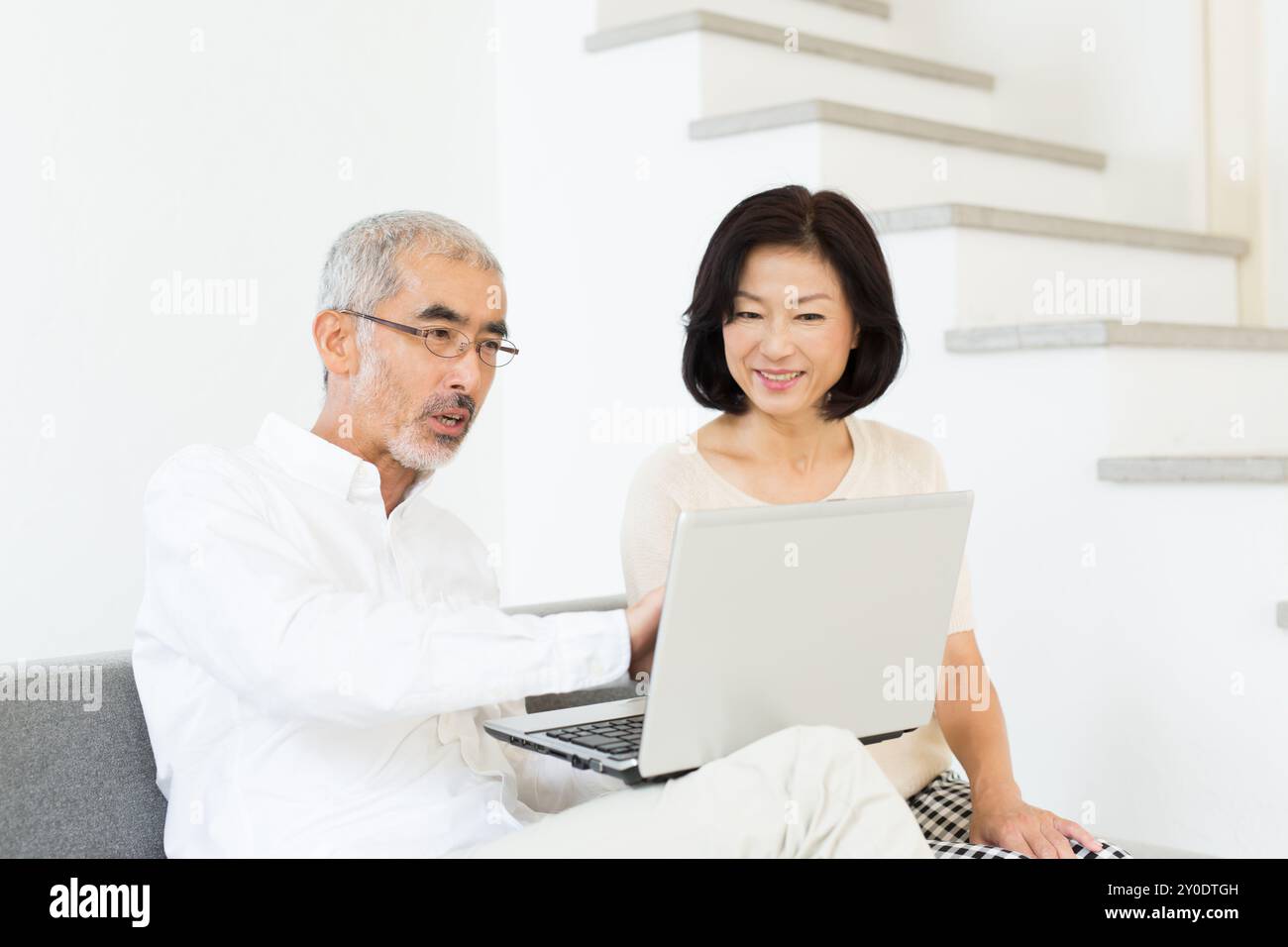 A middle age couple using their computer Stock Photo