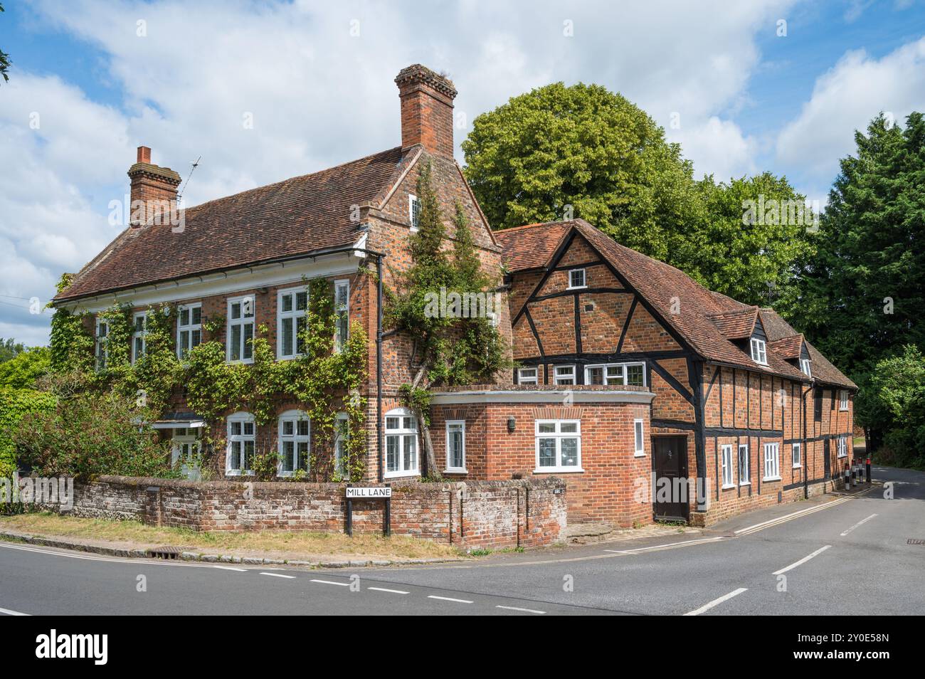 Brick built house adjoining former flour mill on the River Misbourne in Mill Lane Amersham Old Town Buckinghamshire England UK Stock Photo
