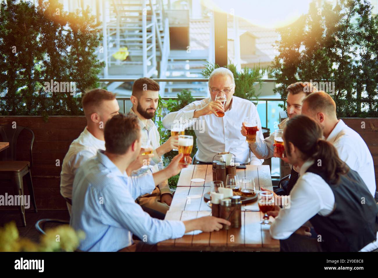Beer Meating Productive meeting, businessmen in formal wear gathering at outdoor bar ...
