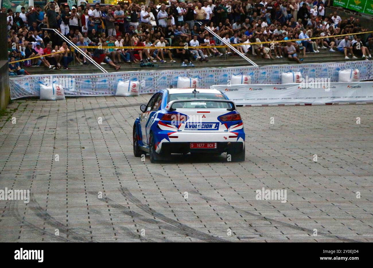 Abraham Cabrera Sanchez driving a Mitsubishi Evo X rally car in the 17th Cristian Lopez Rally Palacio de Deportes Santander Cantabria Spain 02/08/2024 Stock Photo