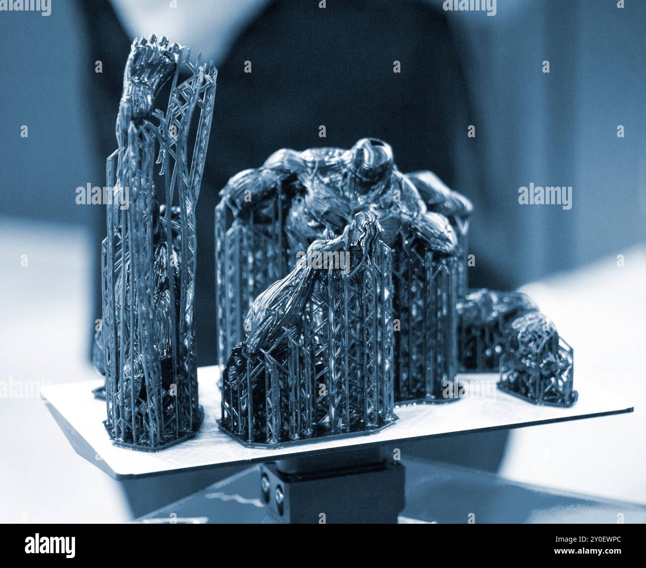 Black model with supports printed on 3D printer close-up. Part of ...