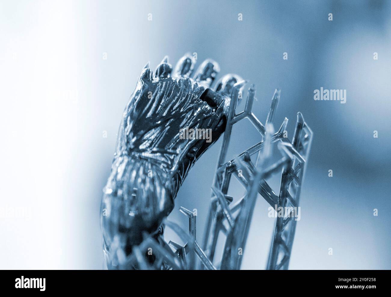 Model of leg printed on a 3D printer from black rubber, close-up. Part ...