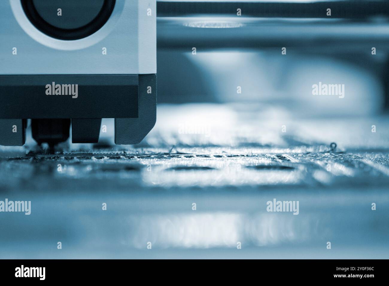 3D printer close up. A working 3D printer in process of printing object ...