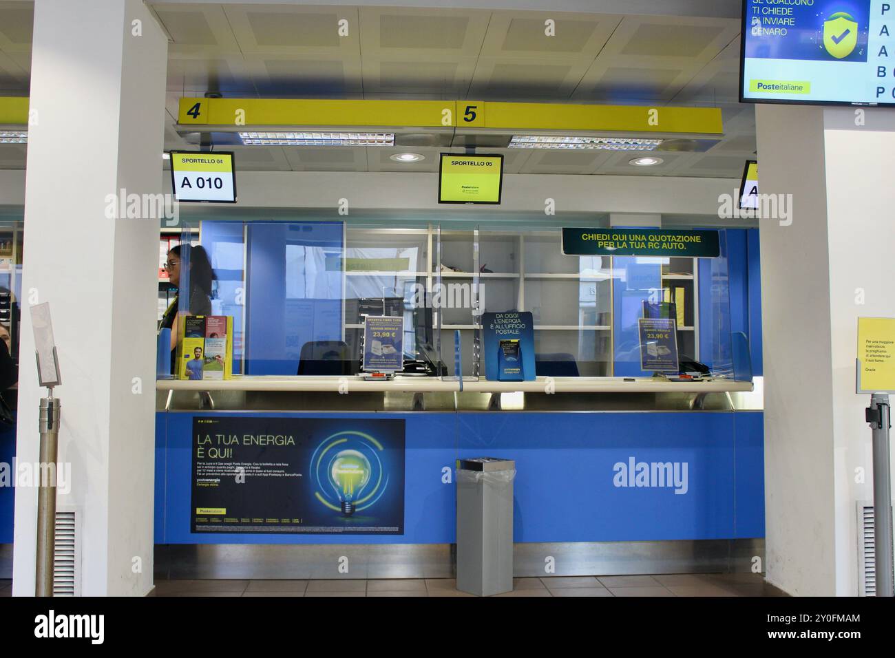 Post Office Screen inside the monopoli post office italy with counter and screens Stock ...