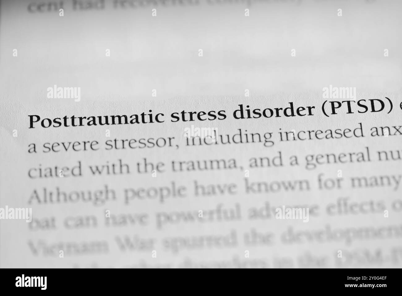 Closeup of Psychology Textbook Word 'Posttraumatic Stress Disorder (PTSD)' Stock Photo