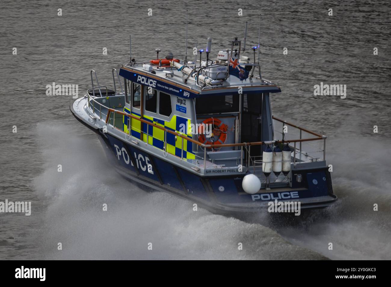 Marine Police Force speed down the river thames in London. Stock Photo