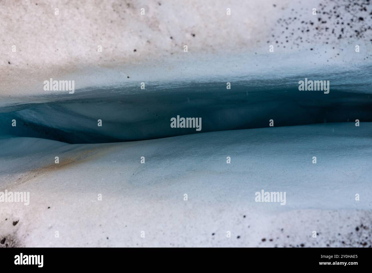 Deep, blue crevasse in glacier ice in Skaftafell Glacier, part of Vatnajokull National Park, Iceland, top view. Stock Photo