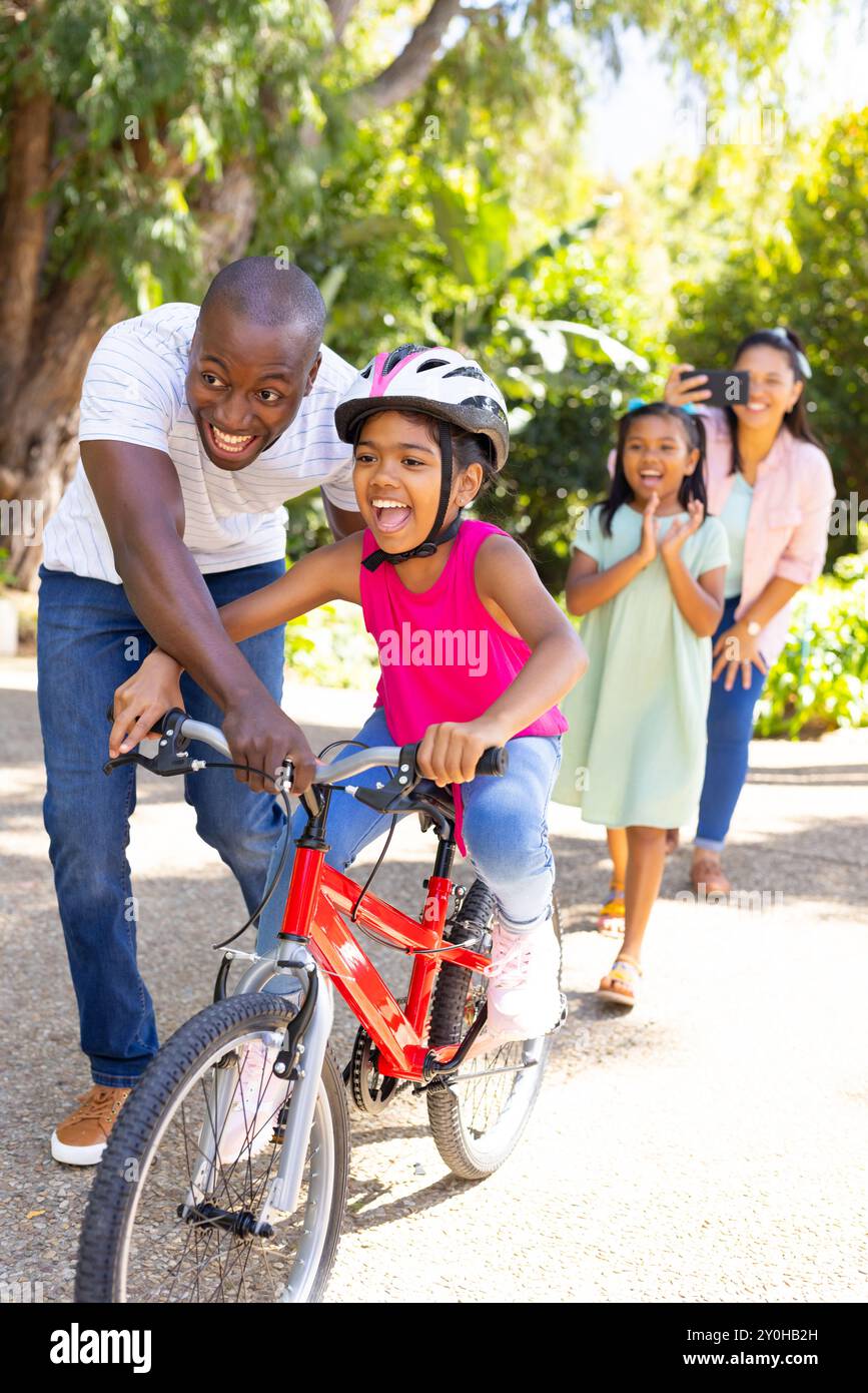 Mother teaching daughter ride bicycle hi res stock photography and images Alamy