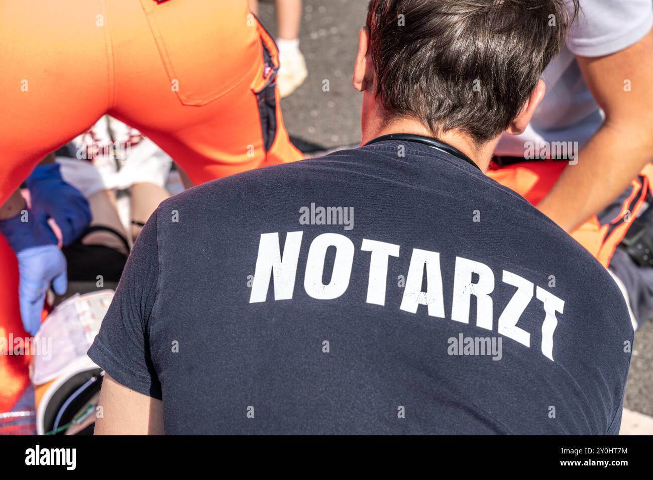 Emergency medicine, emergency doctor on duty at the scene of an accident, together with paramedics, symbolic image, during an emergency exercise, Stock Photo