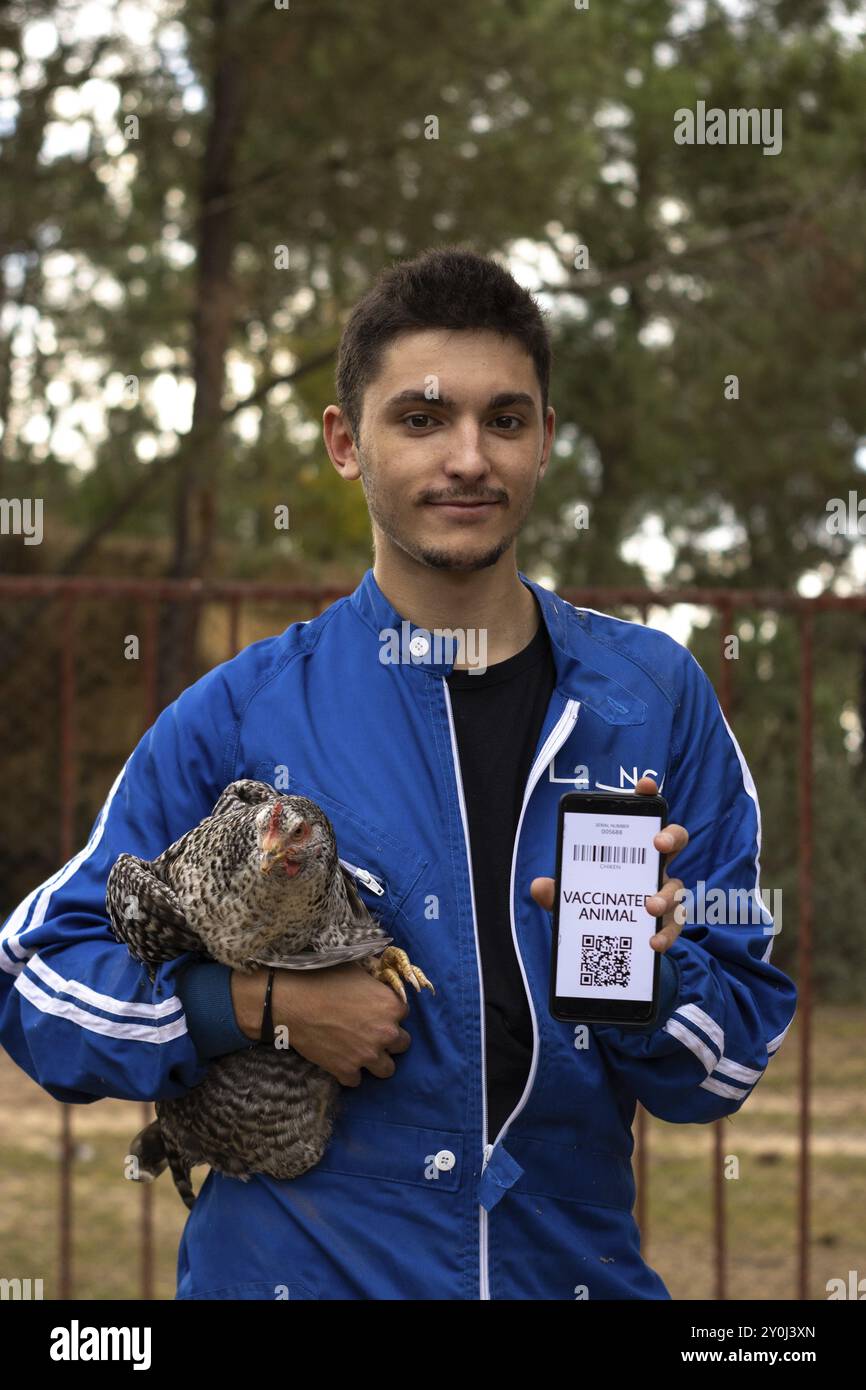 Portrait of a veterinarian showing the vaccination certificate of a ...