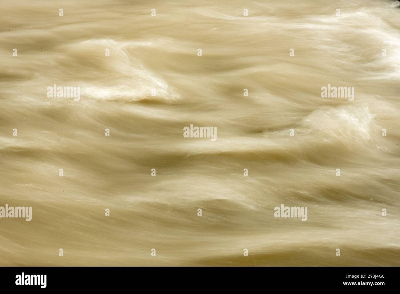 Small Waves Of Muddy Snow Melt Fill The Carbon River In Mount Rainier Stock Photo