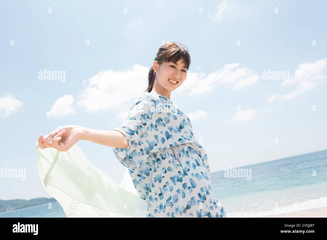 Smiling Woman on the Beach Stock Photo