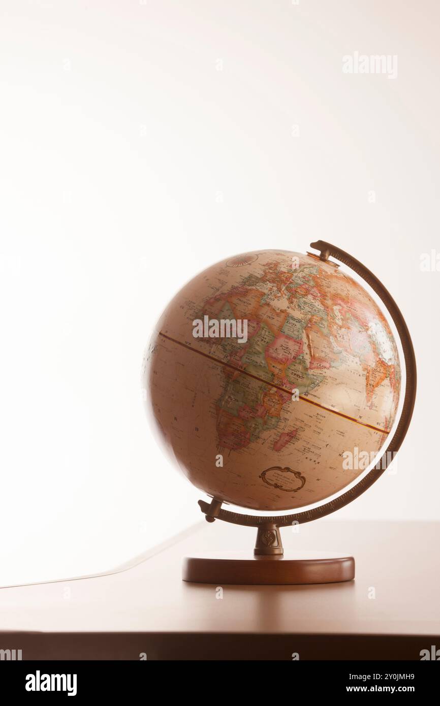 Globe placed on the desk Stock Photo - Alamy