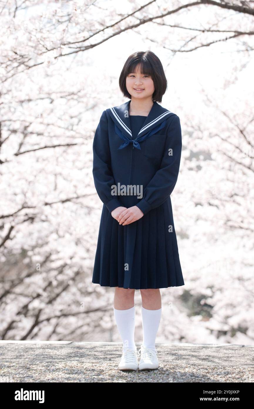 Junior high school girl and cherry blossom Stock Photo - Alamy