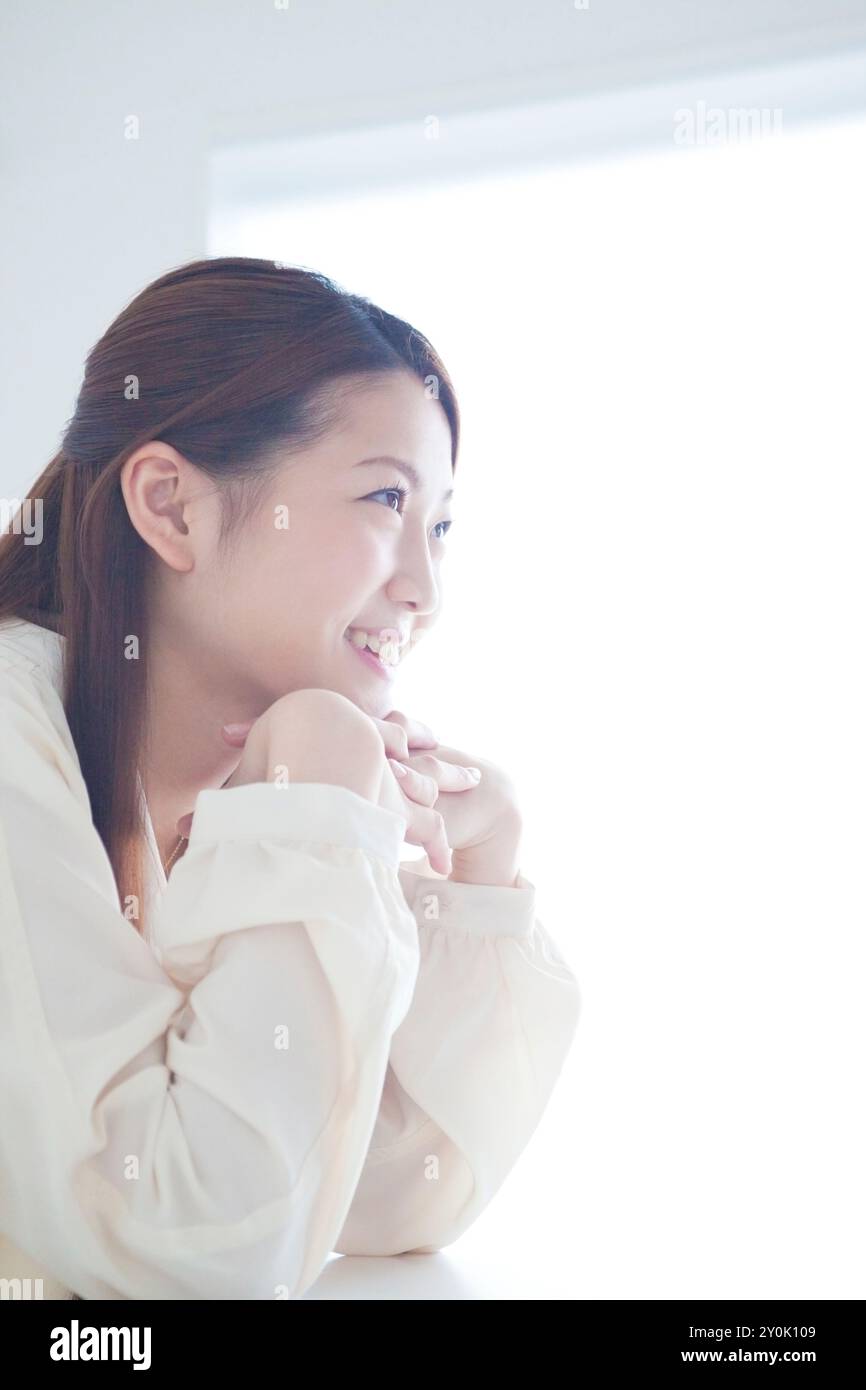 Profile of woman in her 20s smiling Stock Photo - Alamy