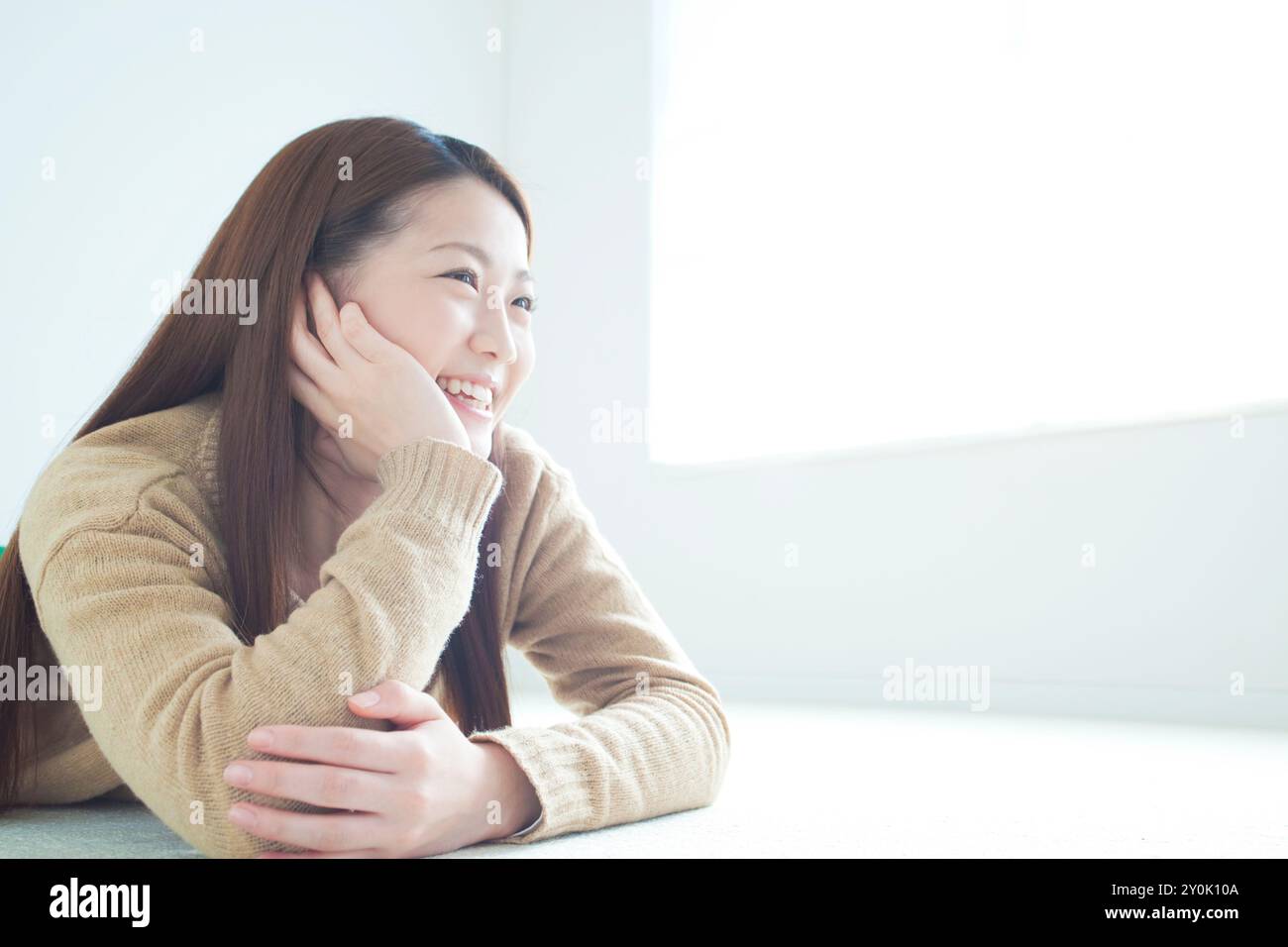 Profile of woman in her 20s smiling Stock Photo - Alamy