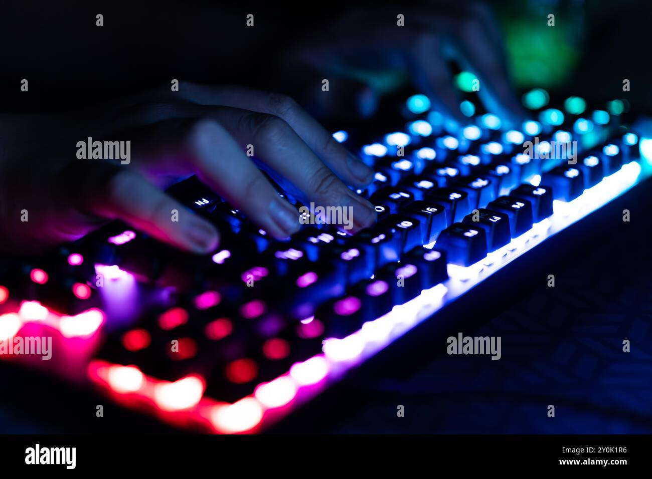 Hacker using laptop. Lots of digits on the computer screen. Stock Photo