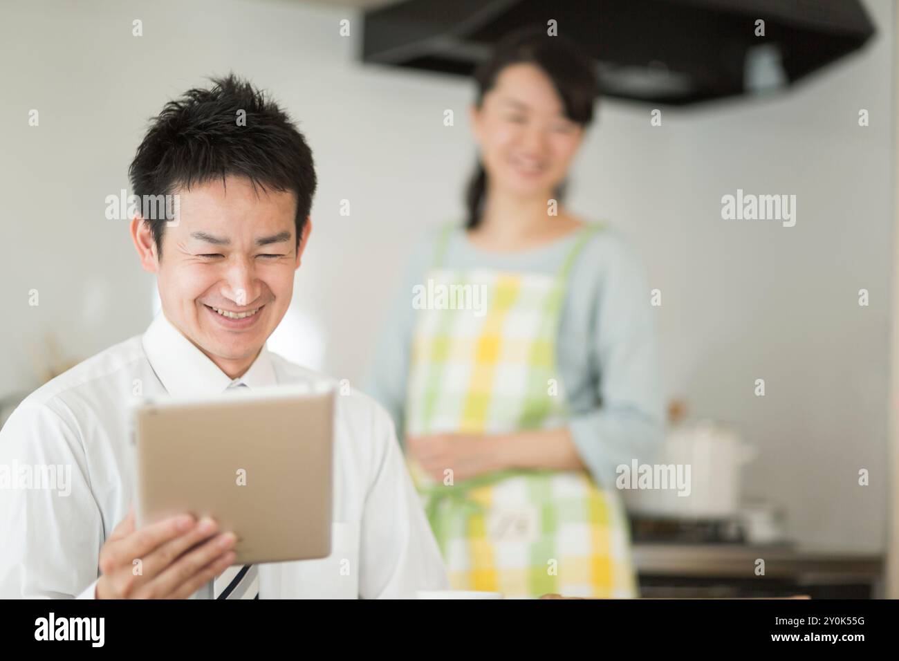 Husband watching a tablet Stock Photo