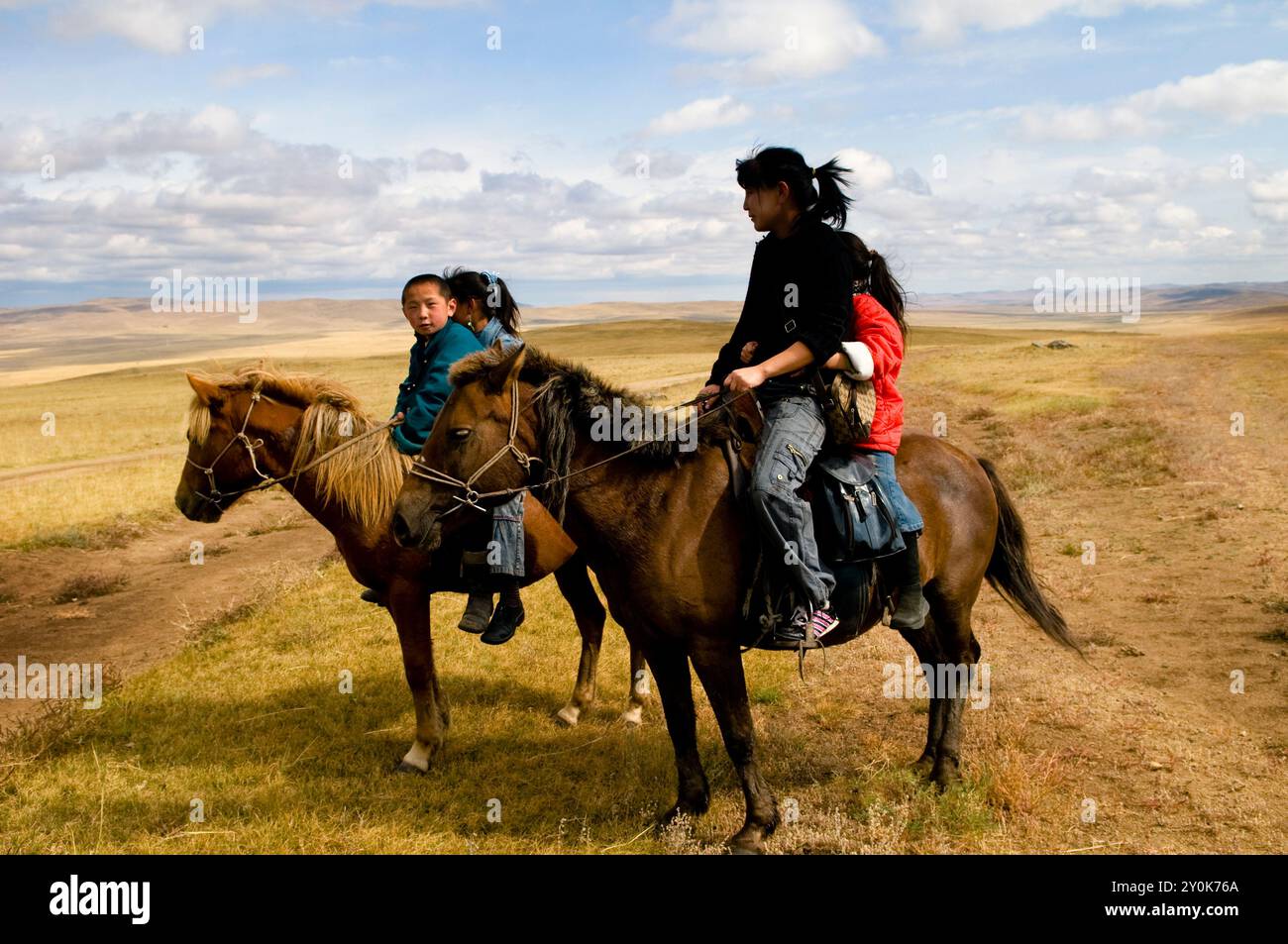 A nomadic family on their horses in the Orkhon valley in Mongolia Stock ...