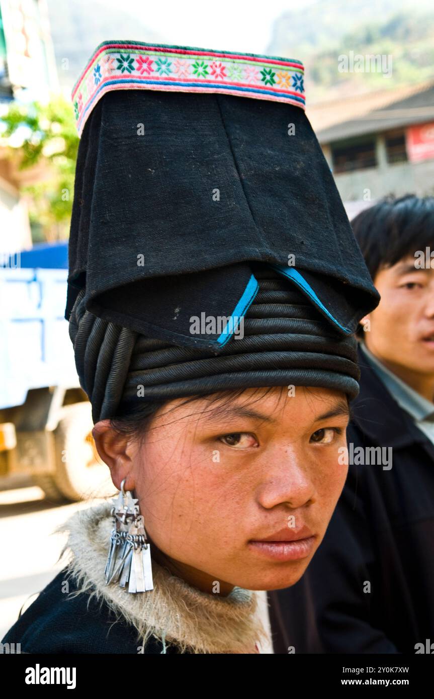 Portrait of a Black Yao woman taken at a colorful weekly market in southern Yunnan province ,by the border of Vietnam, China. Stock Photo