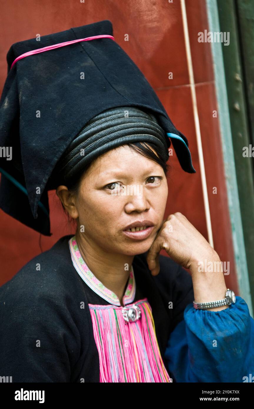 Portrait of a Black Yao woman taken at a colorful weekly market in southern Yunnan province ,by the border of Vietnam, China. Stock Photo